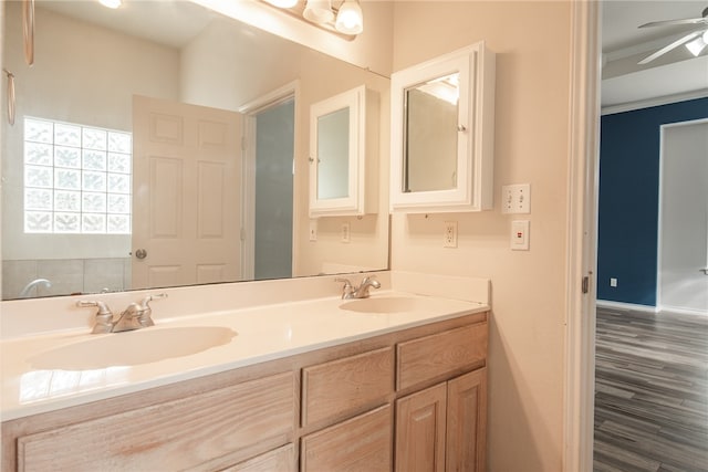 bathroom with vanity, hardwood / wood-style flooring, and ceiling fan