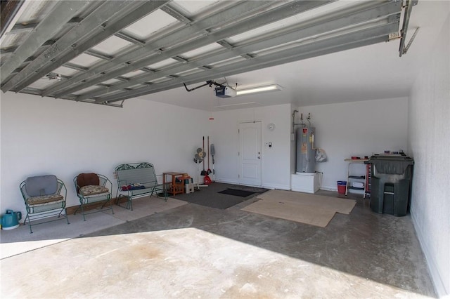 garage with a garage door opener and electric water heater