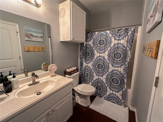 full bathroom featuring vanity, toilet, and shower / bathtub combination with curtain