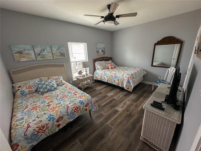 bedroom featuring ceiling fan and dark hardwood / wood-style floors