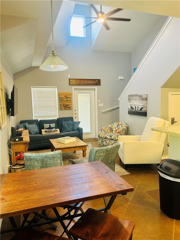 tiled living room with ceiling fan