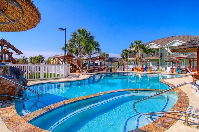 view of swimming pool featuring a patio area and a gazebo