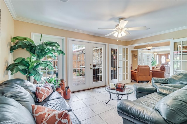 living room featuring ceiling fan, plenty of natural light, french doors, and ornamental molding