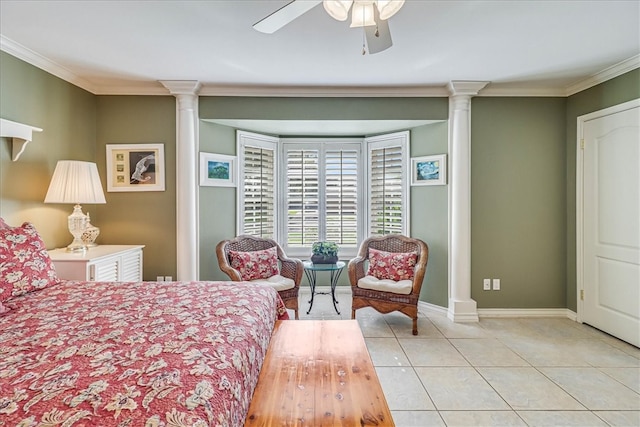 tiled bedroom with ornamental molding, ceiling fan, and decorative columns