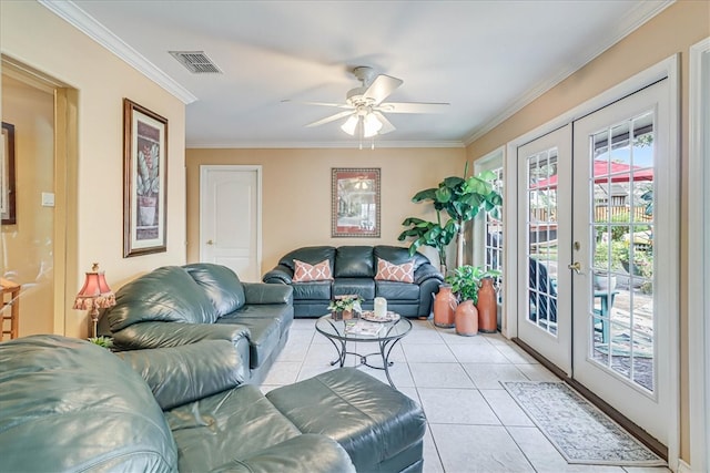 tiled living room with french doors, ceiling fan, and crown molding