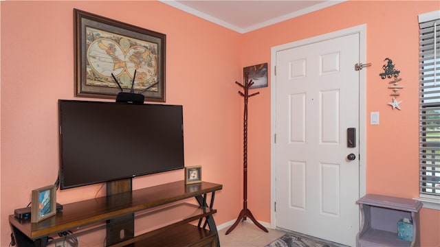 foyer with light tile patterned floors and ornamental molding