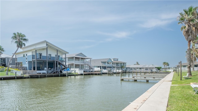 dock area featuring a water view and a balcony