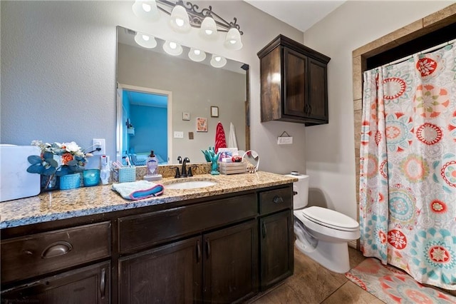 bathroom with tile patterned flooring, vanity, toilet, and a shower with shower curtain