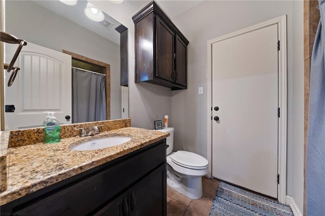 bathroom with a shower with curtain, tile patterned flooring, vanity, and toilet