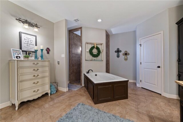 bathroom with shower with separate bathtub and vanity