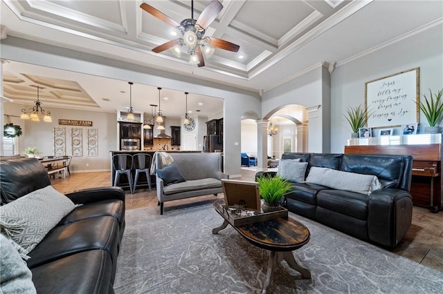 living room with ornamental molding, decorative columns, and coffered ceiling