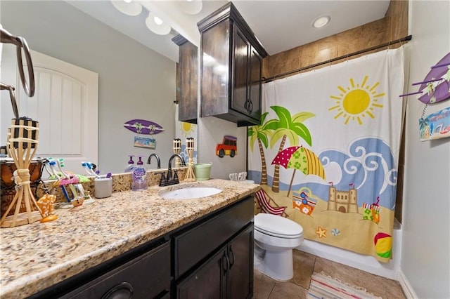 full bathroom with tile patterned flooring, vanity, toilet, and shower / bath combo with shower curtain