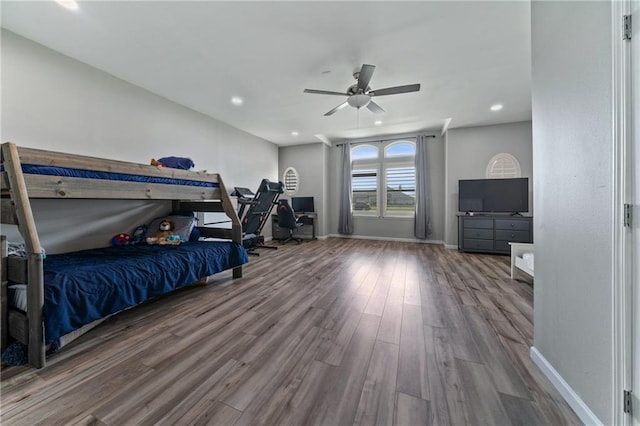 bedroom featuring ceiling fan and wood-type flooring