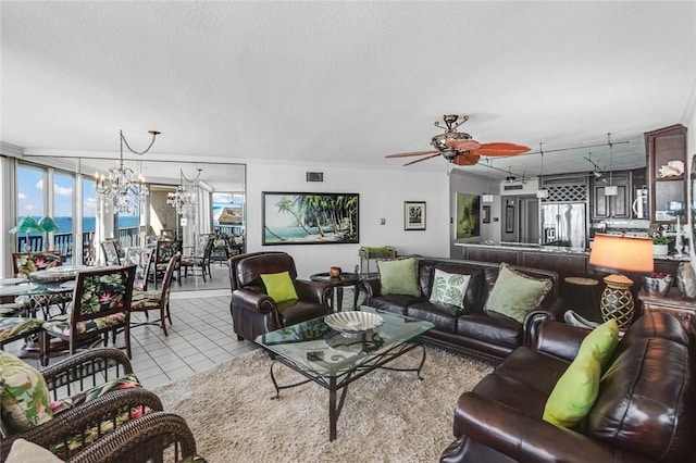 living area with light tile patterned floors, visible vents, a textured ceiling, and ceiling fan with notable chandelier