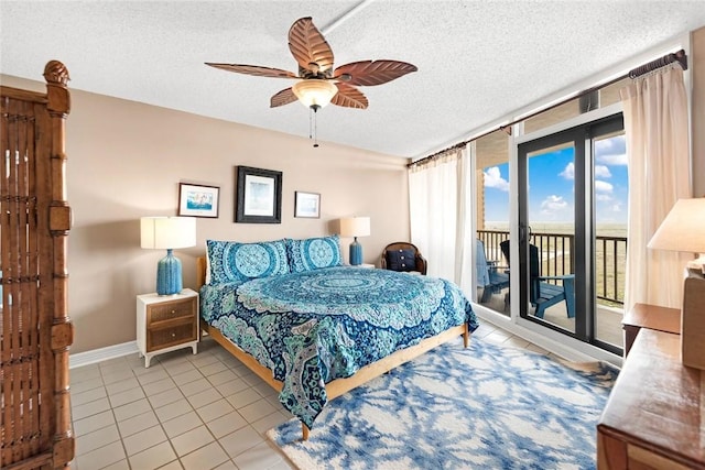 bedroom featuring tile patterned floors, a textured ceiling, access to exterior, and a ceiling fan