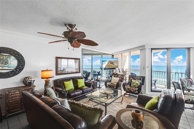 tiled living room featuring a textured ceiling and ceiling fan