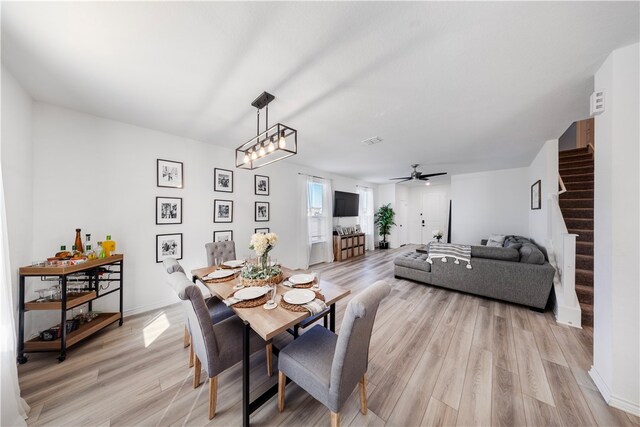 dining area featuring ceiling fan and light hardwood / wood-style floors