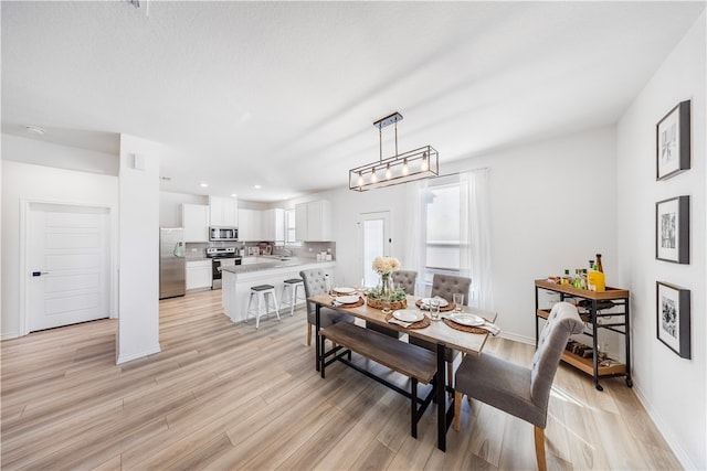 dining room featuring light wood-type flooring