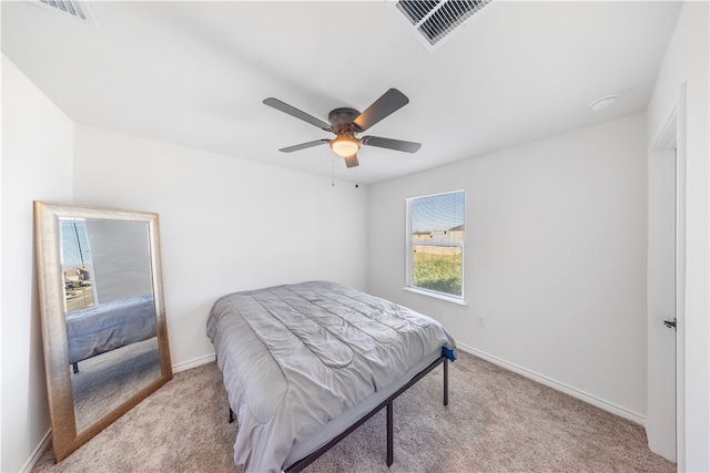 bedroom with light carpet and ceiling fan