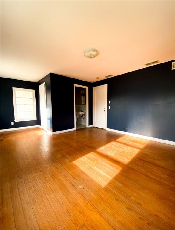 601 E Joyce St, Bishop, TX 78343 - empty room featuring hardwood / wood-style floors and baseboards