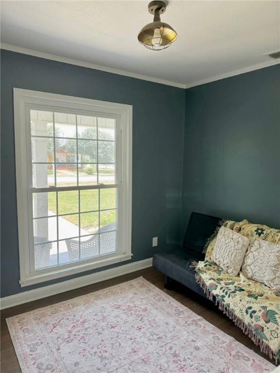 601 E Joyce St, Bishop, TX 78343 - living room featuring wood finished floors and ornamental molding