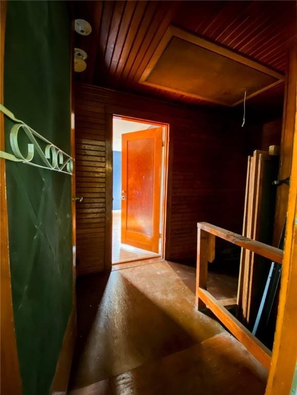 601 E Joyce St, Bishop, TX 78343 - hallway featuring wood ceiling and wooden walls