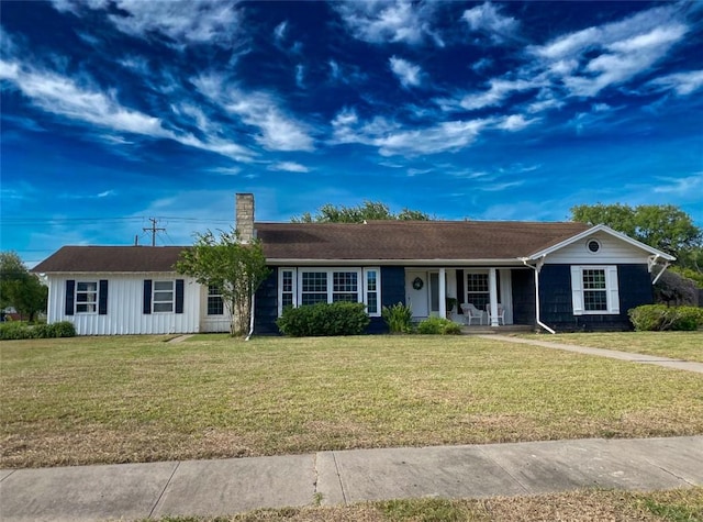 601 E Joyce St, Bishop, TX 78343 - single story home featuring covered porch, a front lawn, and a chimney