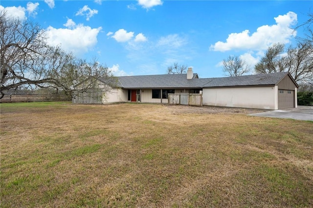 ranch-style home featuring a chimney and a front yard