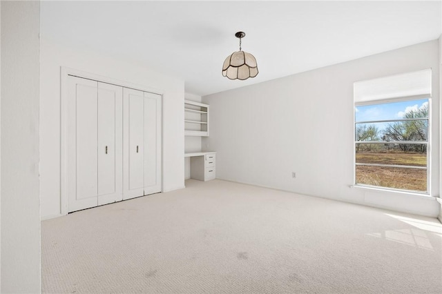 unfurnished bedroom with carpet floors and a closet