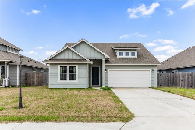 view of front facade with a garage and a front lawn