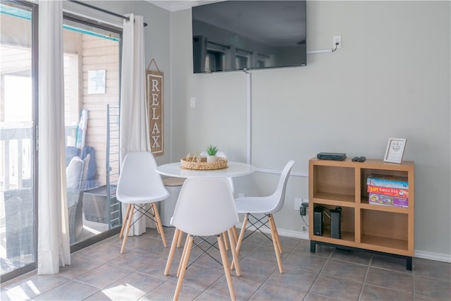 dining space with a healthy amount of sunlight and tile patterned floors