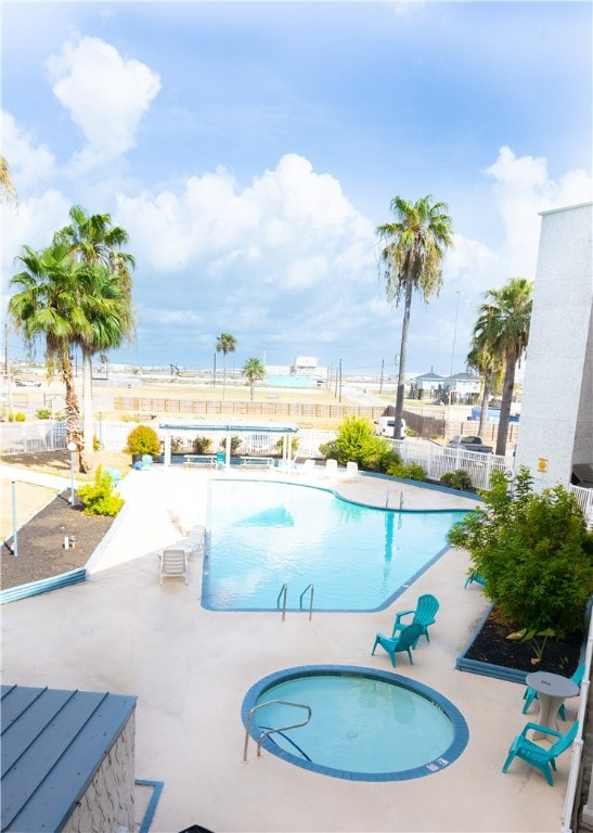 view of swimming pool with a patio area