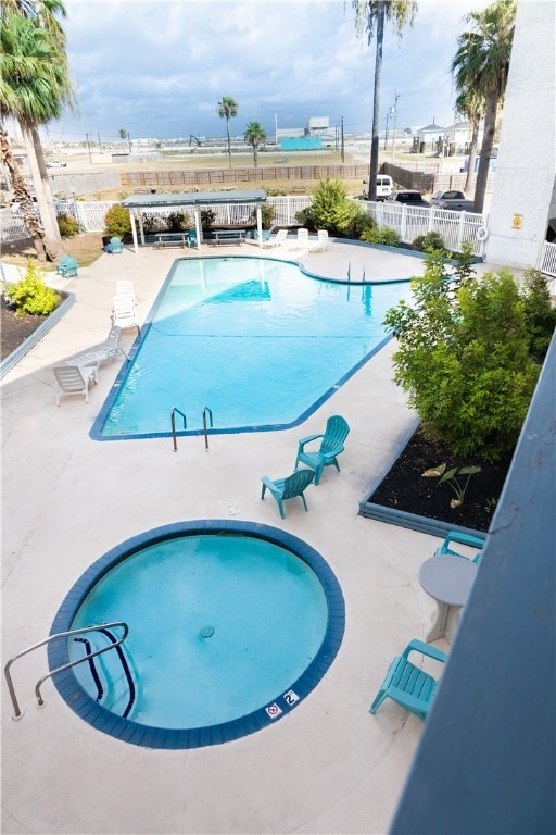 view of swimming pool featuring a patio