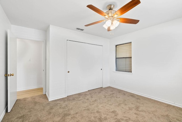 2201 Woodcrest Dr, Corpus Christi, TX 78418 - unfurnished bedroom with carpet floors, a closet, and ceiling fan
