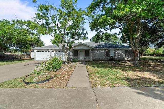 2201 Woodcrest Dr, Corpus Christi, TX 78418 - view of front of house with driveway and an attached garage