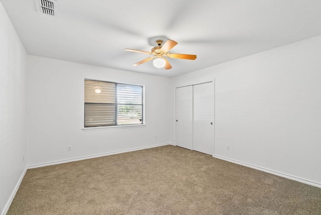 2201 Woodcrest Dr, Corpus Christi, TX 78418 - unfurnished bedroom featuring carpet flooring, a closet, and ceiling fan