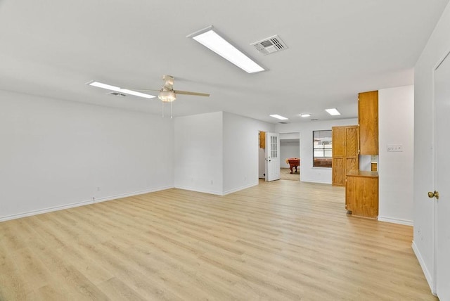 2201 Woodcrest Dr, Corpus Christi, TX 78418 - unfurnished living room with light wood-style floors and a ceiling fan