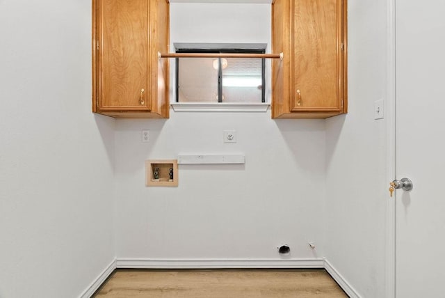 2201 Woodcrest Dr, Corpus Christi, TX 78418 - laundry area featuring hookup for an electric dryer, washer hookup, cabinet space, and wood finished floors