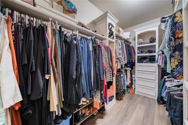 spacious closet featuring hardwood / wood-style floors