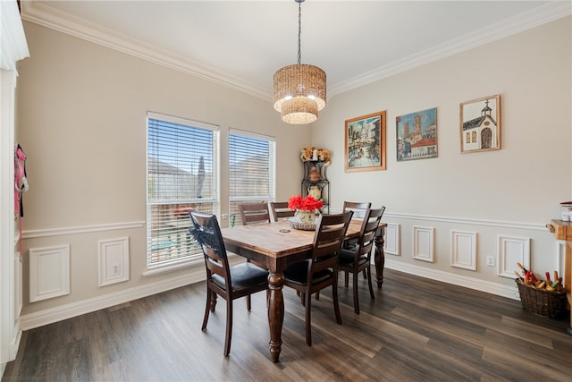 dining room featuring dark hardwood / wood-style flooring, crown molding, and an inviting chandelier