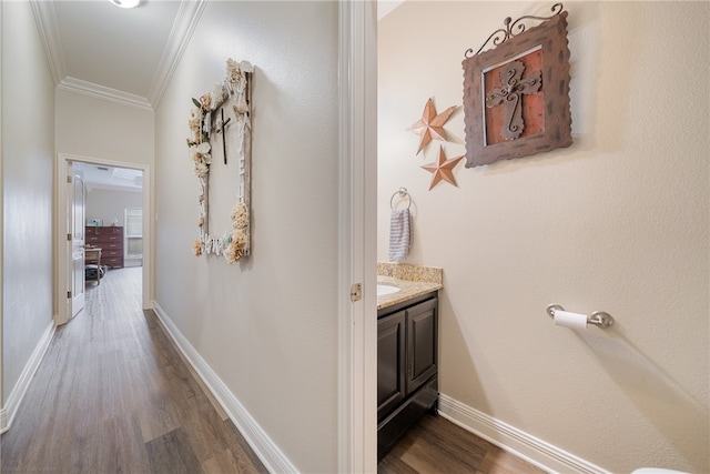 hall with dark hardwood / wood-style flooring and ornamental molding