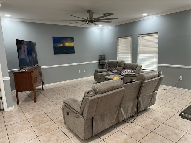 tiled living room with ceiling fan and crown molding