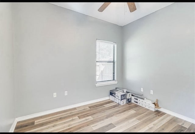 unfurnished room with ceiling fan and light hardwood / wood-style flooring