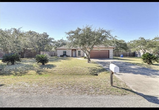 ranch-style home with a garage and a front lawn