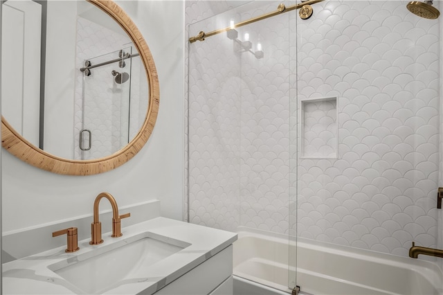 bathroom featuring vanity and bath / shower combo with glass door