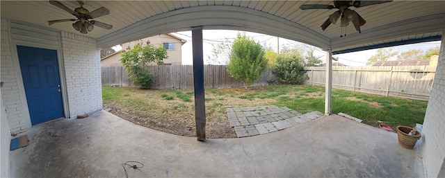 view of patio featuring ceiling fan