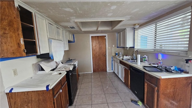 kitchen featuring black appliances, light tile patterned floors, and sink