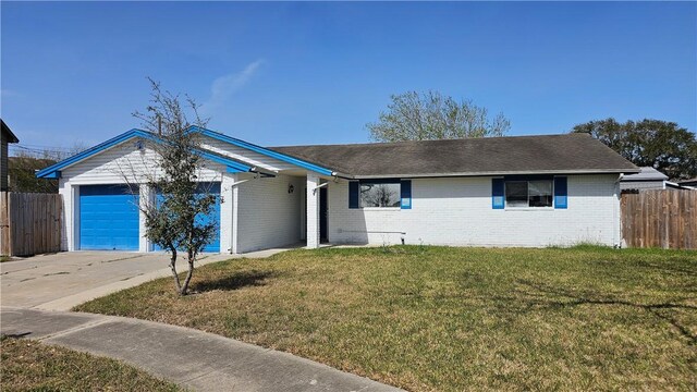 single story home with brick siding, concrete driveway, fence, a garage, and a front lawn