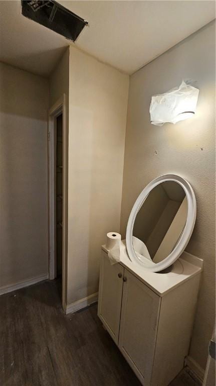 bathroom with hardwood / wood-style flooring