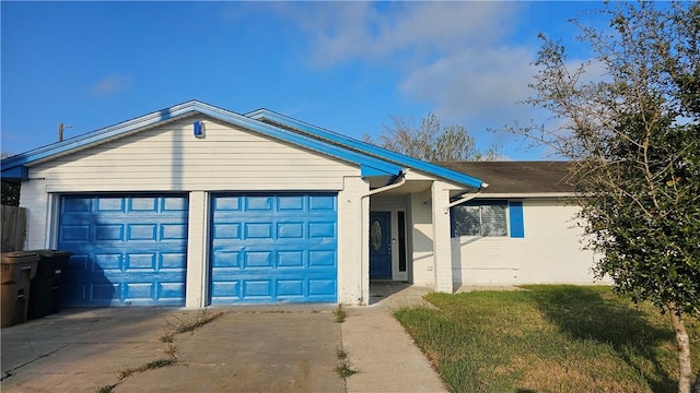 ranch-style house featuring a garage